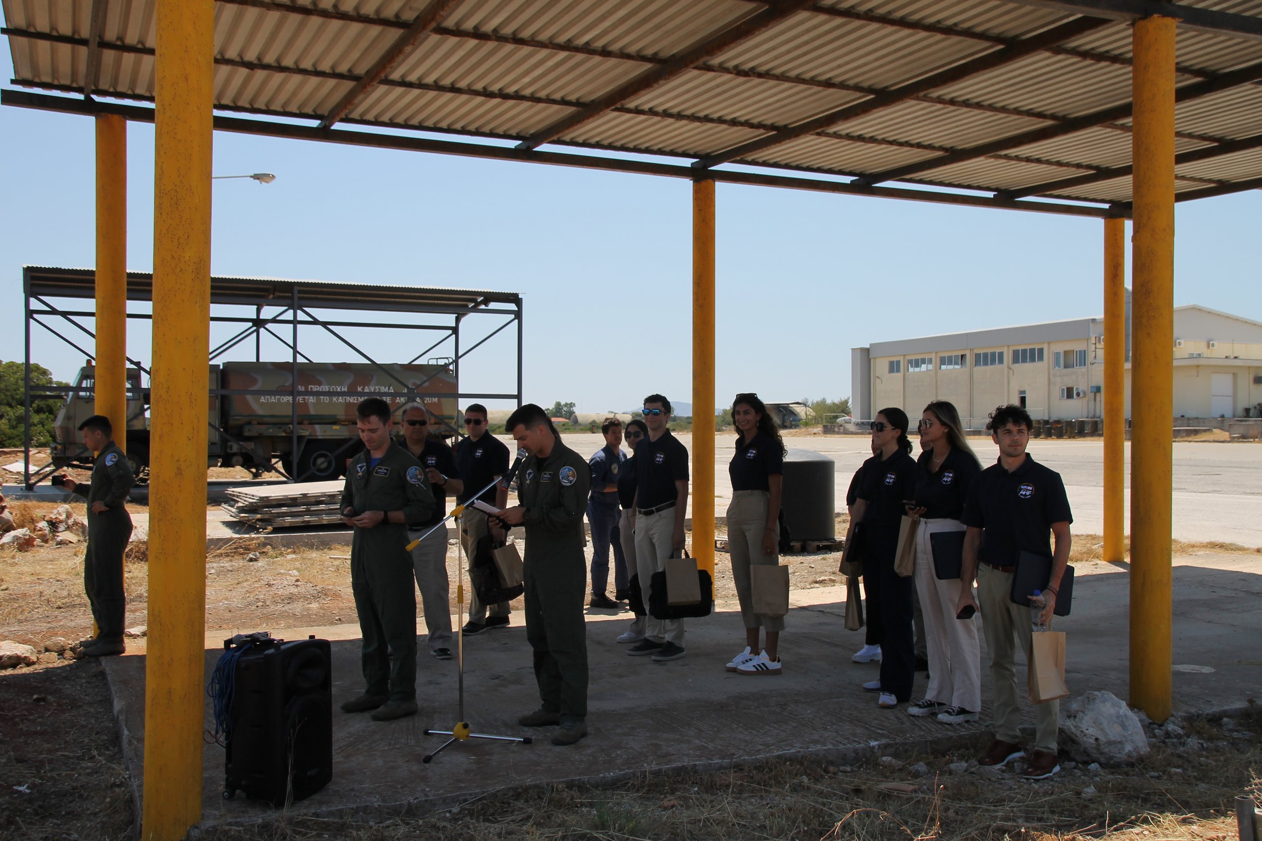  Students observing a private air performance by the Hellenic Air Force with narration on each maneuver. 