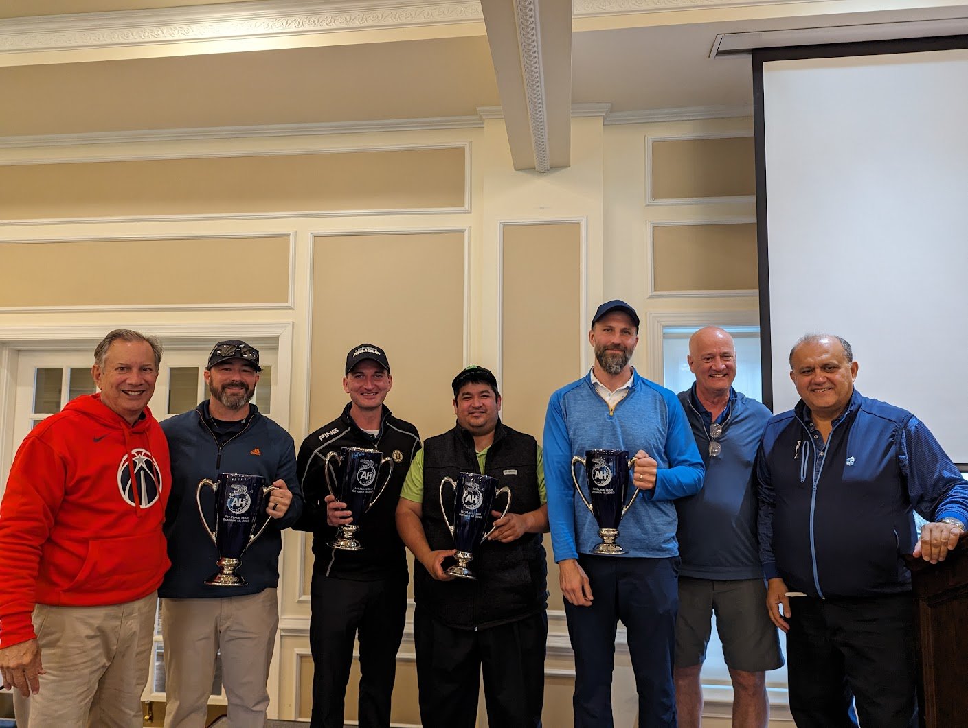  First place team being presented their trophies: Peter Marketos, Leif Ackerman, Marcus Malone, and Gustavo Leal.  