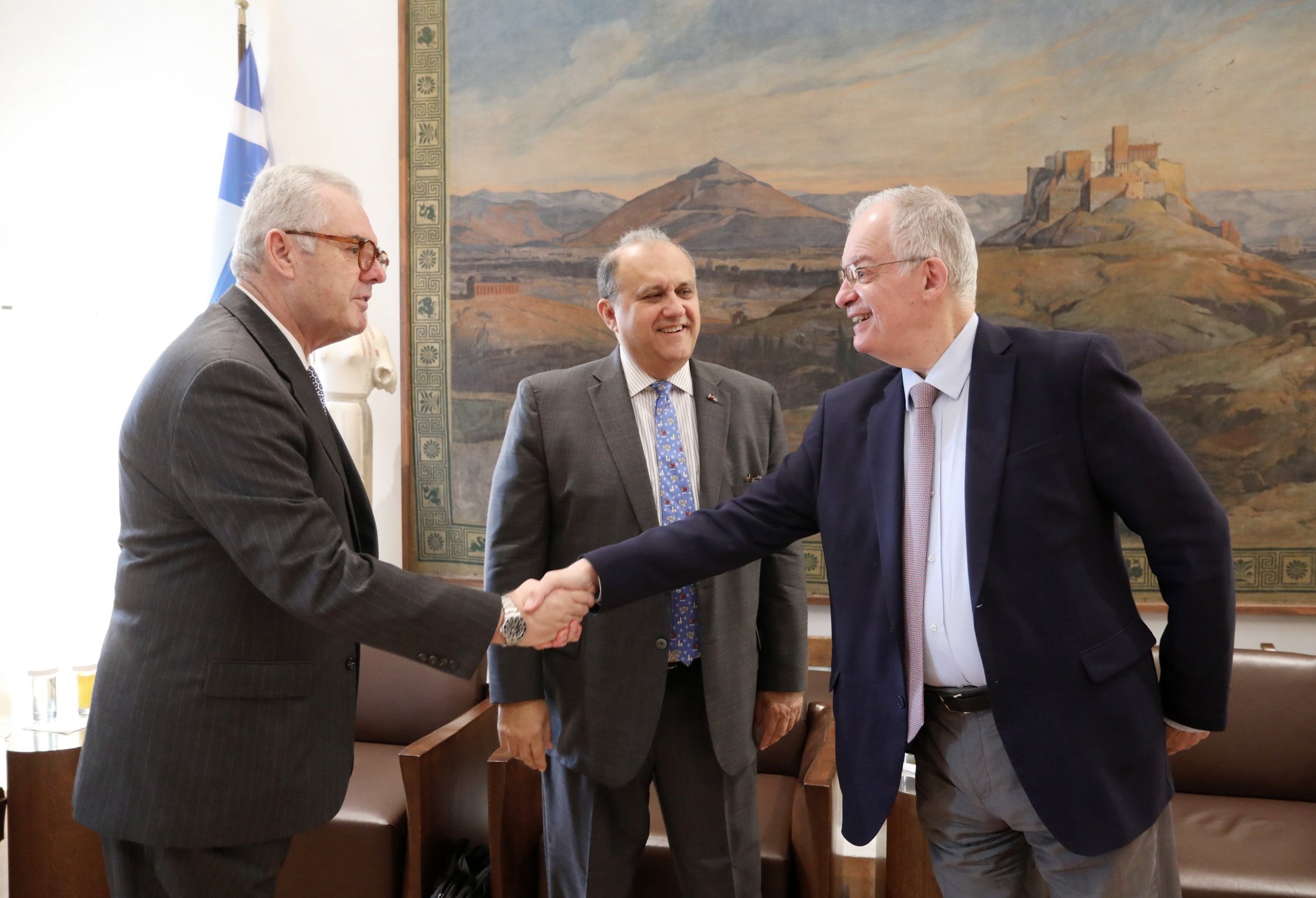  AHI Athens Chapter President Vice Admiral Vasileios Kyriazis shakes hands with President of the Hellenic Parliament Konstantinos Tasoulas. 