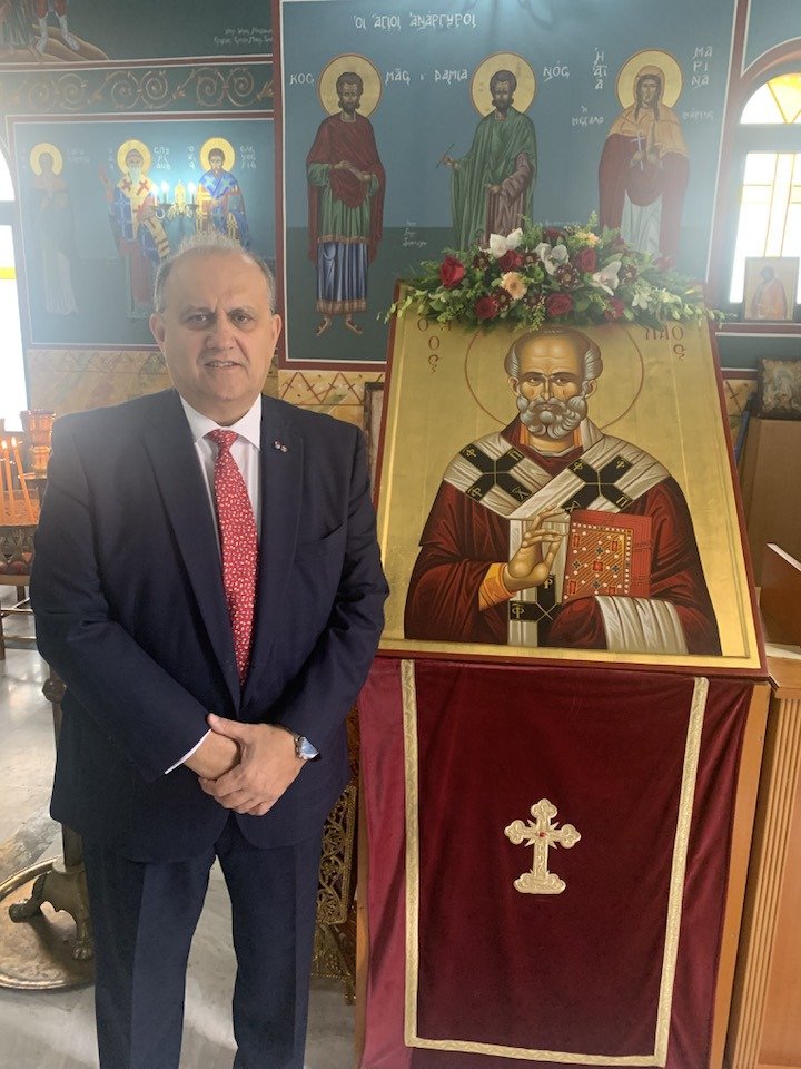  President Larigakis with an icon of St. Nicholas, the Patron Saint and Protector of the Hellenic Navy, during the Feast Day Celebration at the chapel of the Hellenic Naval Academy. 