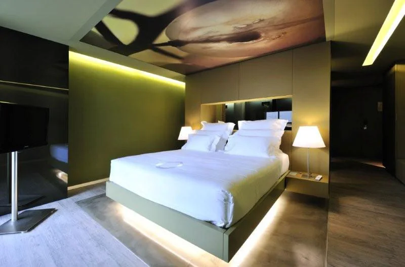 Grand Deluxe Spring // The contemporary design and the vine themed decor add a vanguardist edge to our spacious Grand Deluxe rooms, with french balcony. Photo © The Vine Hotel, Portugal