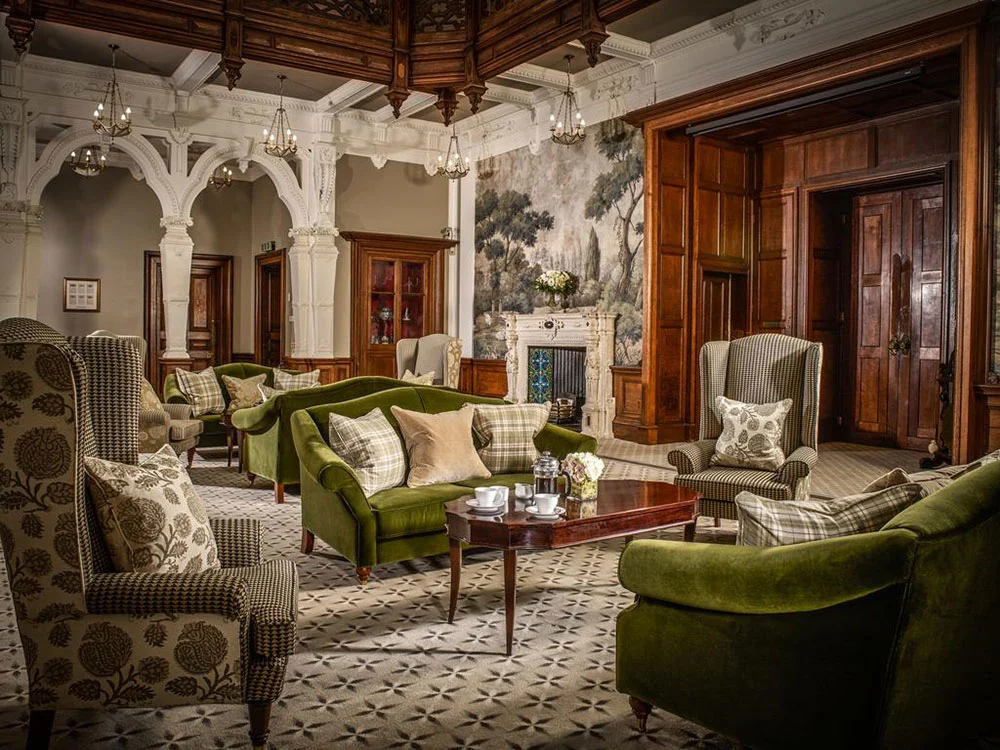 Saloon // You will find our bespoke Casablanca in a classic British green velvet in complete harmony with the stuning wood work of the room. Photography: © Clevedon Hall Wedding Venue.