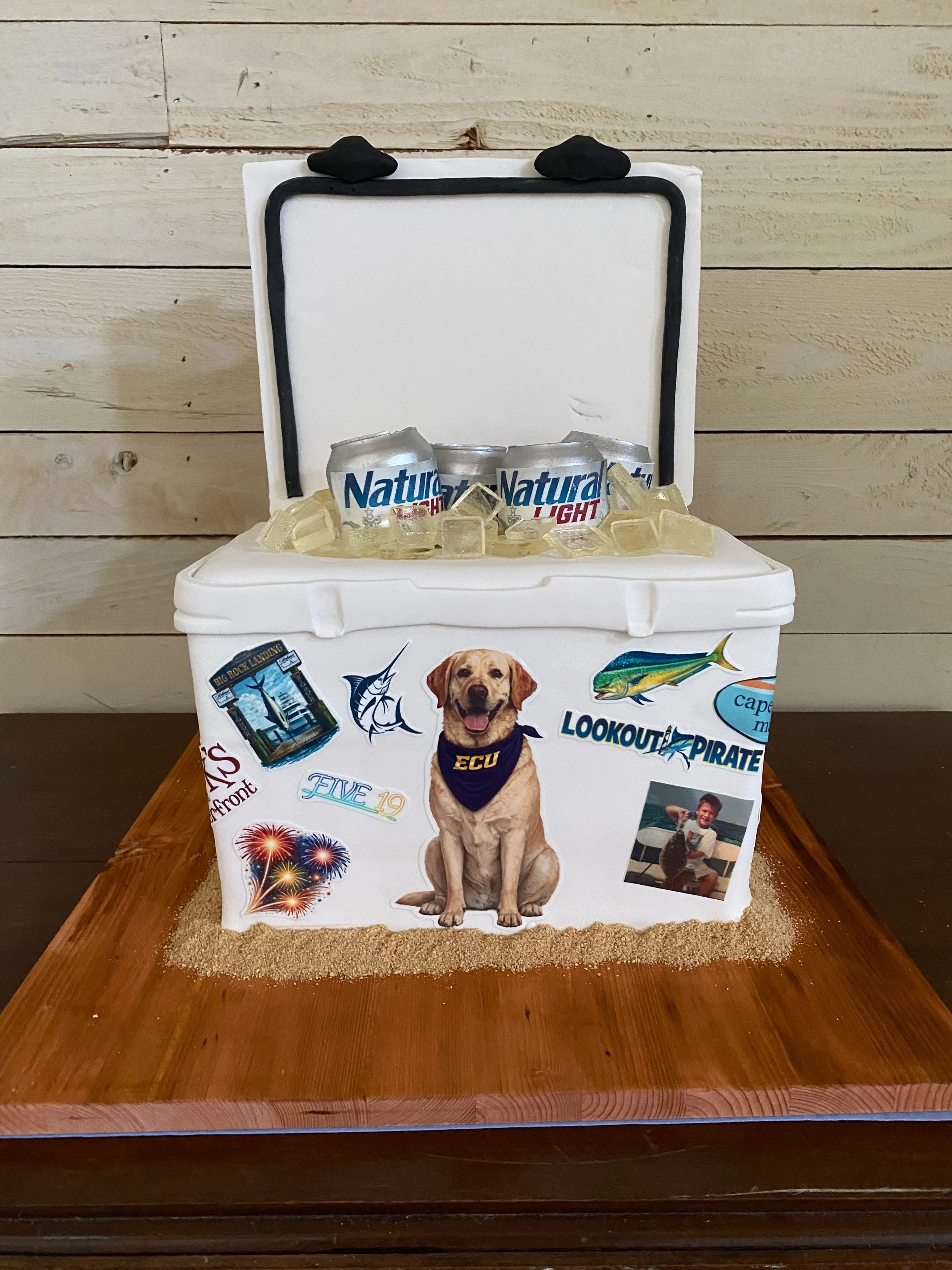What a fun groom&rsquo;s cake for Hunter! His bride selected tons of his favorite things to cover his cake with and his Mom added the super cute photos for an even more personal touch!

Congratulations newlyweds!!