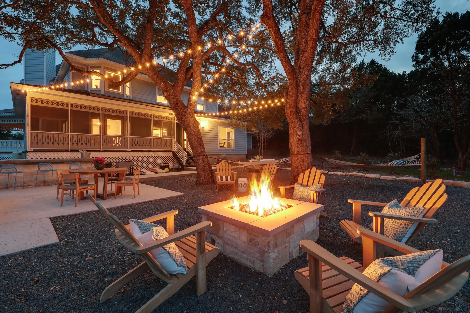 Modern Farmhouse BnB Outdoor - Firepit and Teak Adirondack Chairs.jpg