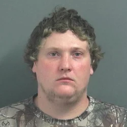 Combative man hiding in bushes, with a long rifle, accused of threats to kill three LPD officers