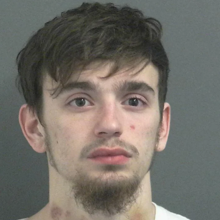 Man on the way to jail accused of kicking LPD officer in the ribs