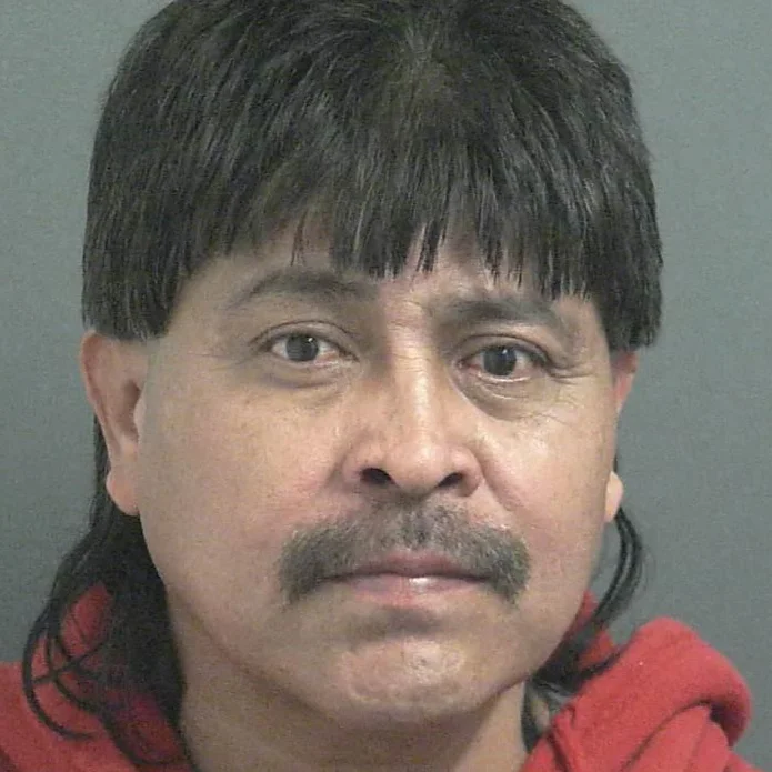 Husband accused of sitting on wife, then threatening her with a knife