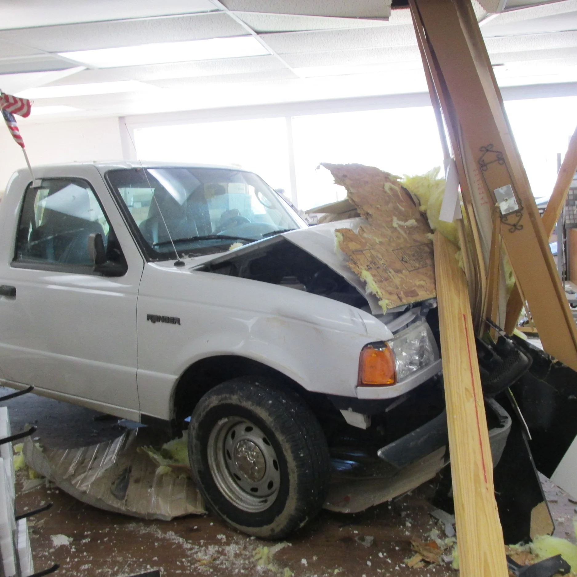 Pickup truck crashes into Flooring America Carpet Store on Friday afternoon