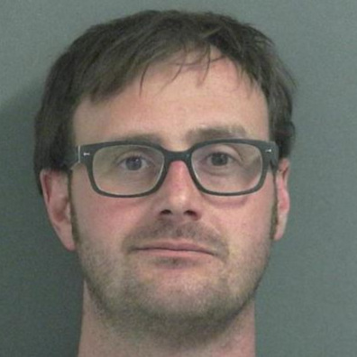 Driver charged with five misdemeanors after crashing truck into a fence