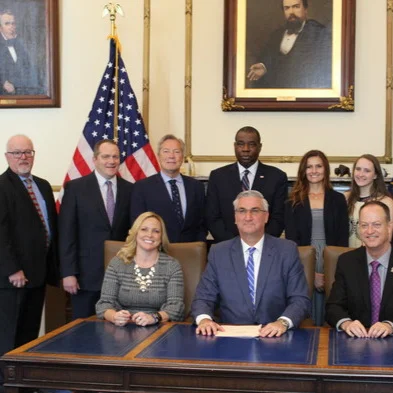 Governor signs victims' rights bill with prosecutors, IPAC leadership
