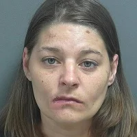 Woman found lying in a backyard winds up in jail