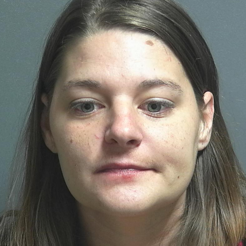 Woman found lying in an alley accused of huffing toxic vapors