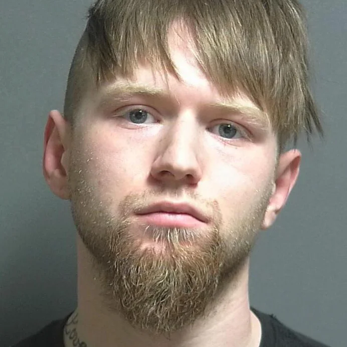 Wanted man accused of heroin possession