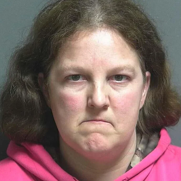 Woman accused of barging into a home with a shotgun in hand