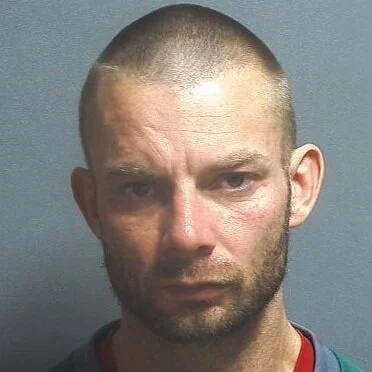 Suspect charged with public intoxication after foot chase