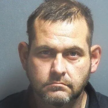 Driver arrested after allegedly pulling out in front of a school bus