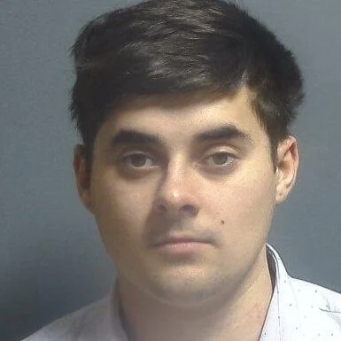 Driver arrested after crossing left of center