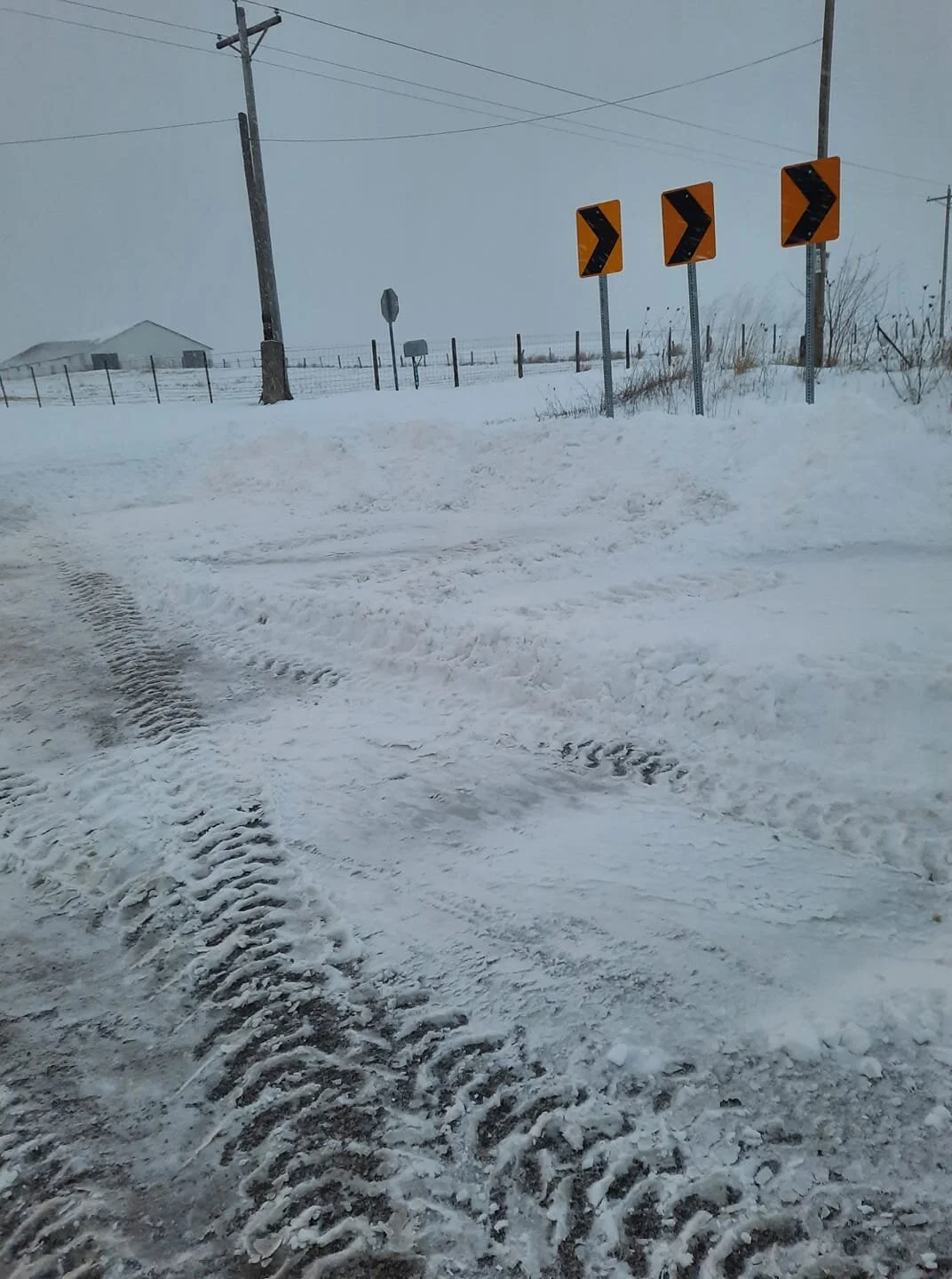Helping to clear snow on a back road near Worthington by Dennis Cullison