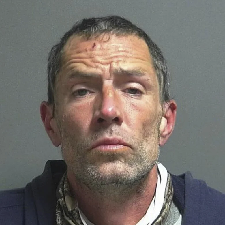 Inmate accused of spitting on a jail officer