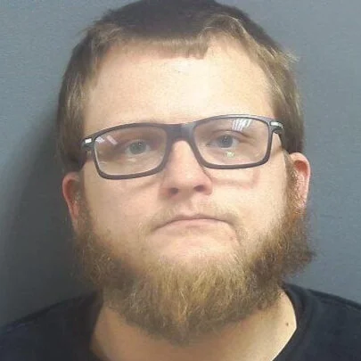 Driver found unresponsive in running car, one foot on the gas, one on the brake