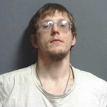 Bloomington man charged with theft, battery and trespassing