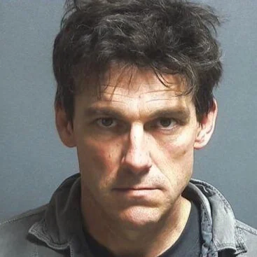 Suspect found hiding under a mobile home arrested for trespassing