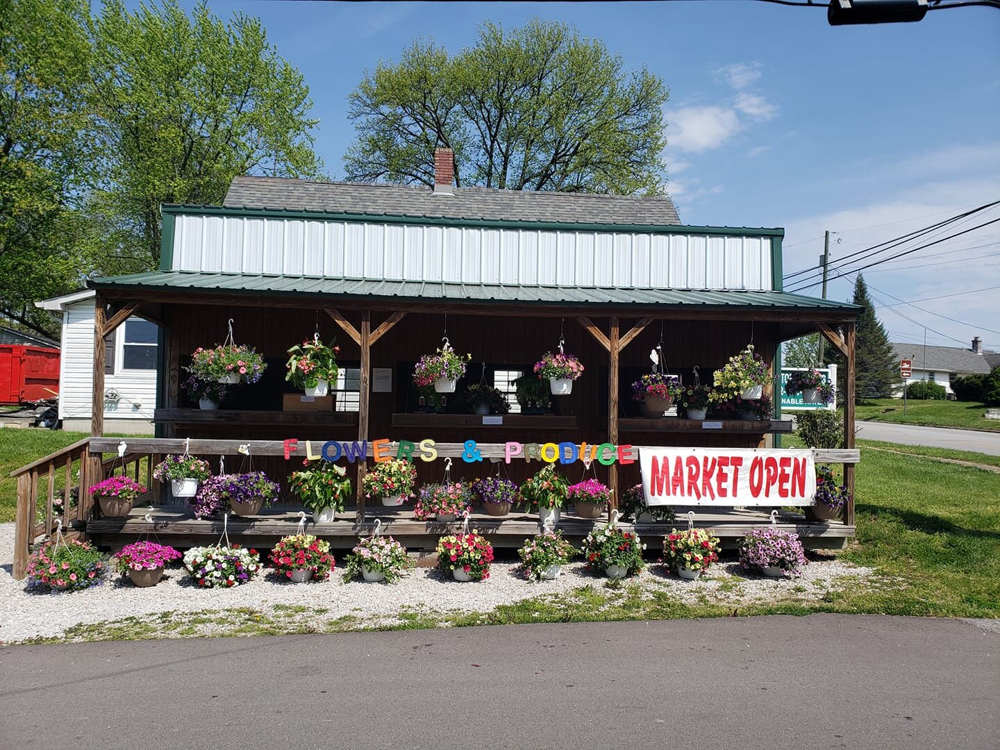 Flower and produce stand in Bloomfield that sometimes operates on the honor system. Photo from Facebook.