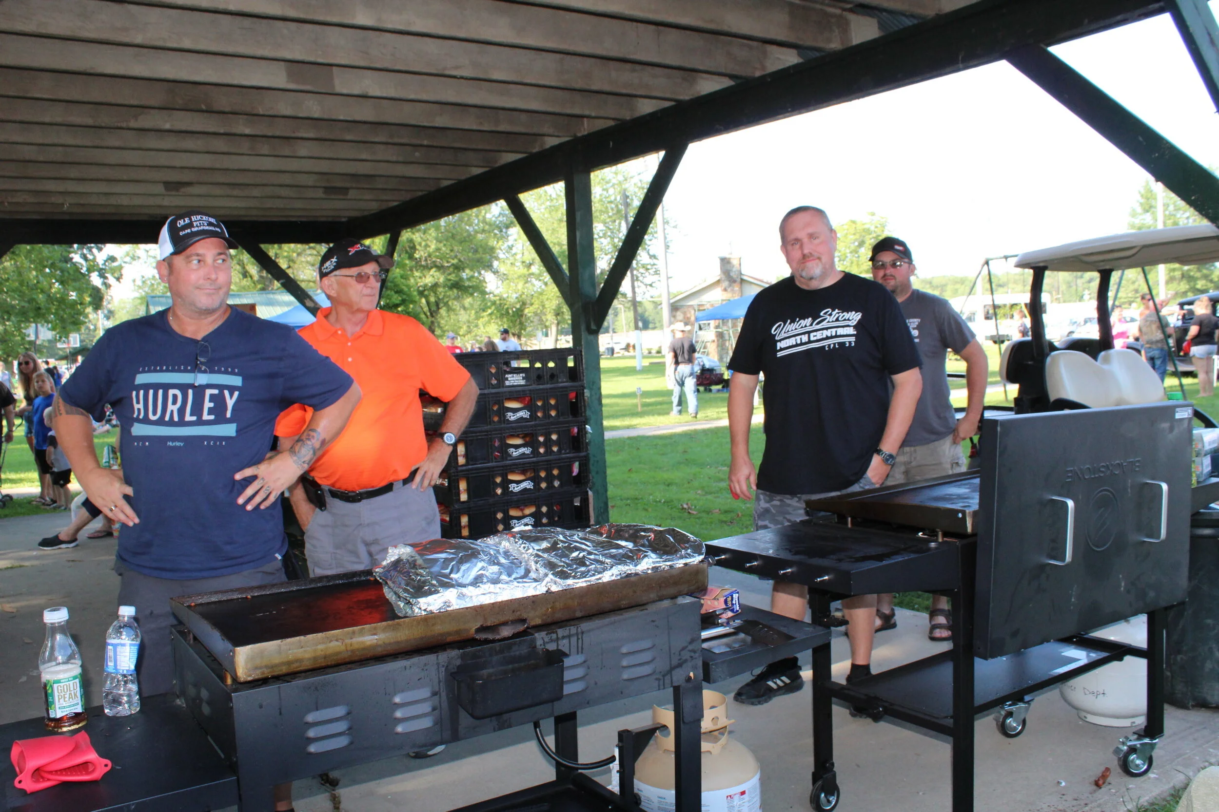  Masonic Lodge members grilling hot dogs for all 