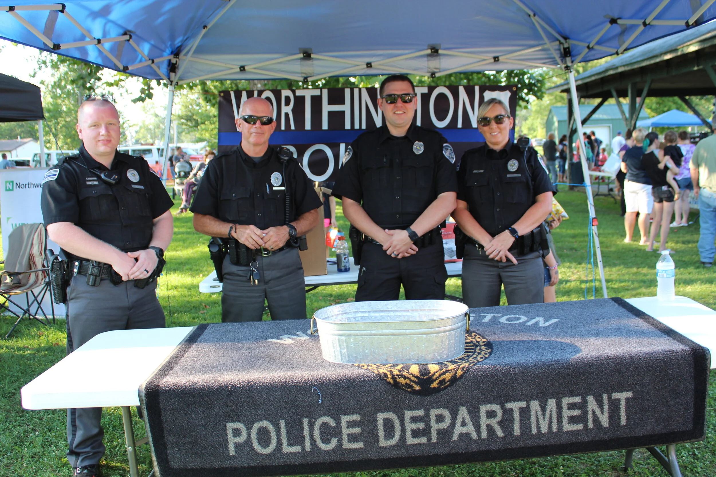  Deputy Marshal Ryan Montgomery, Marshal Jim O’Malley, Reserve Officer Trey Sparks, Deputy Marshal Heather Wood, all Worthington Police Department 