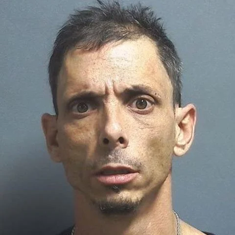 Driver arrested after he was found passed out in parking lot of business