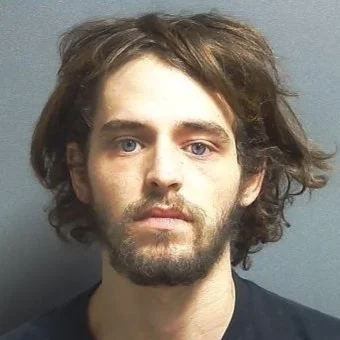 Woman wanted on warrant found hiding under a bed