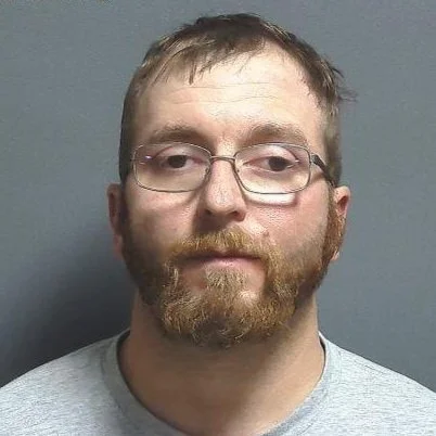 Driver located walking away from crashed pickup stuck in mud