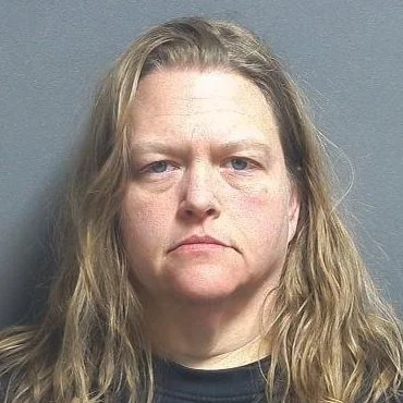 Driver arrested after crashing into a utility pole then damaging two parked cars