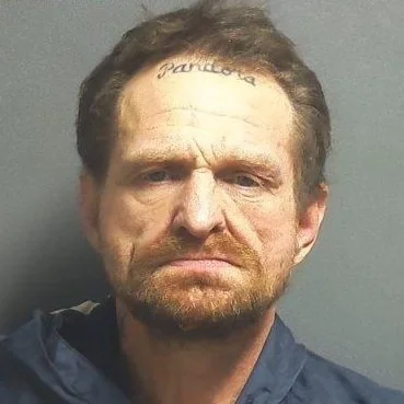 Suspect arrested and charged with intimidation, trespassing and criminal mischief