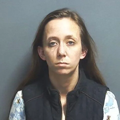 Woman picking up spilled pills in a parking lot winds up in jail last Saturday night