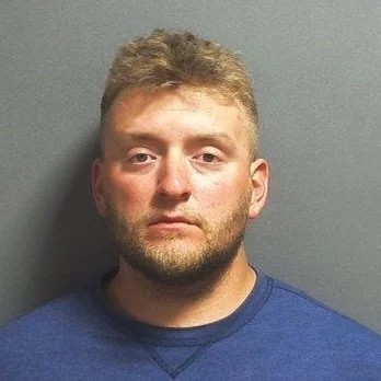 Suspect accused of spitting in face of deputy