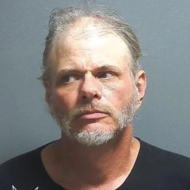 Walker with a warrant out for his arrest recognized by police officers