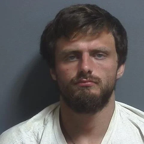 Suspicious man found sleeping outside an apartment building in Bloomfield