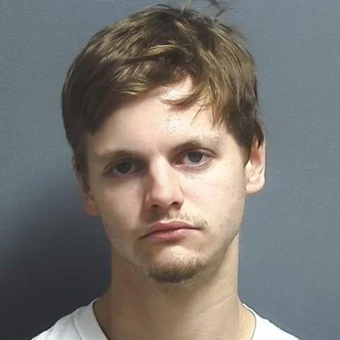 Driver found slumped over in his car stopped in roadway