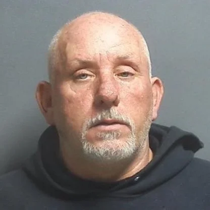 Driver sliding around on gravel road slides himself into jail