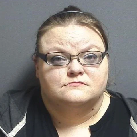 Woman accused of beating child