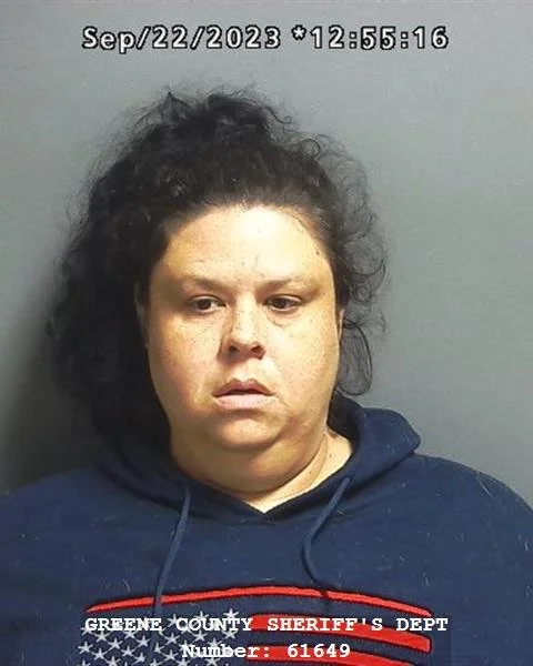 Greenwood woman arrested on warrant after allegedly battering grandson