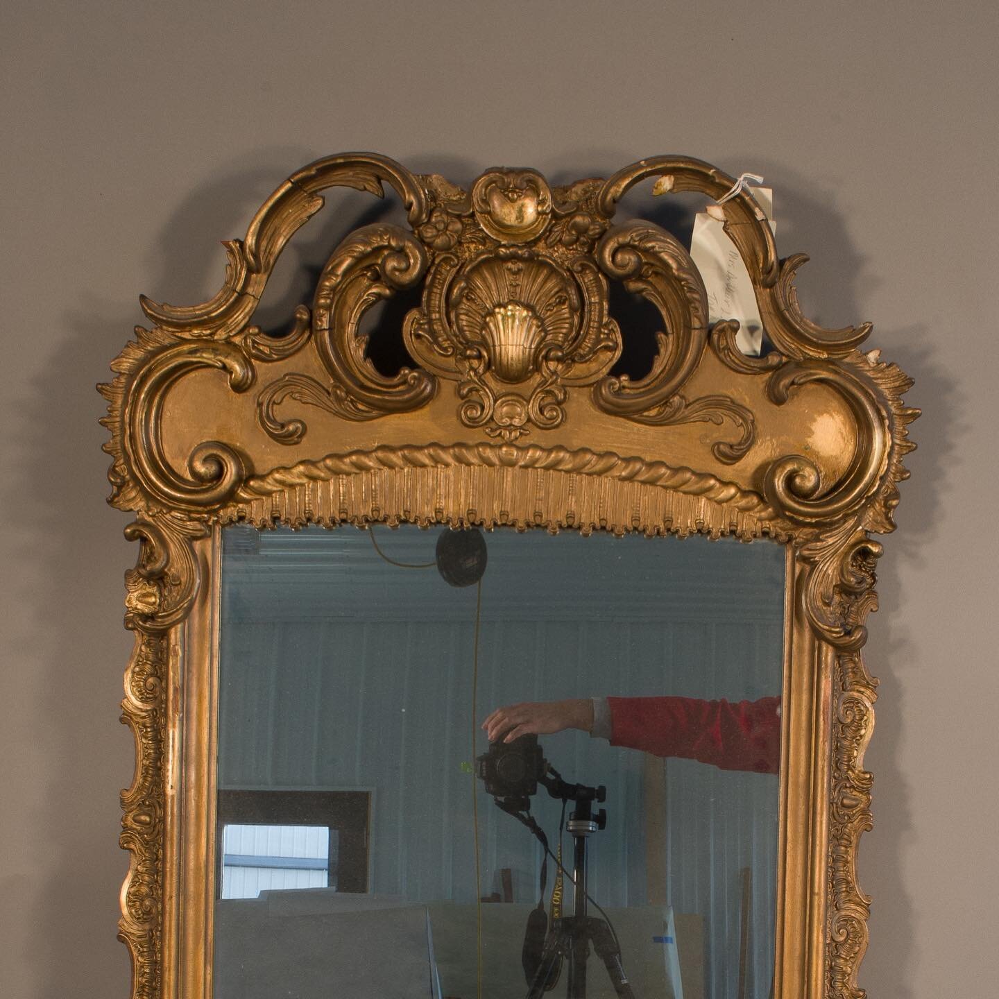 A steamboat pier mirror for the Mighty Mississippi exhibit at the Missouri History Museum. Before removal of bronze paint  and after cleaning with reproduction finial