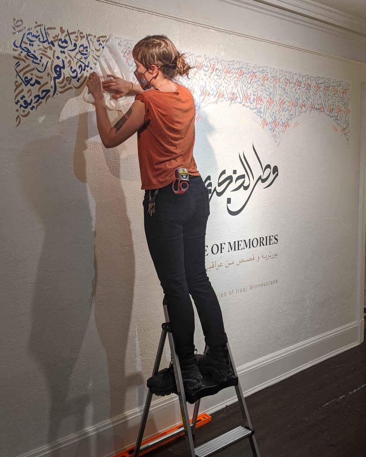 @sarasuppan help installing the big vinyl title wall! Home of Memories travelled from Rochester Art Center, BLAC art center, arriving Hennepin History Museum! Opening reception event 2-4pm Sep 18th! Iraqi traditional tea, sweets, Arabic calligraphy w