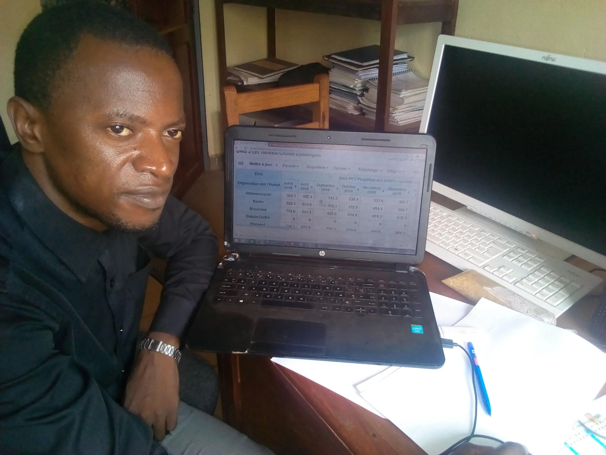 Jean Mory Millimono in his office at the Regional Health Directorate in Faranah, Guinea