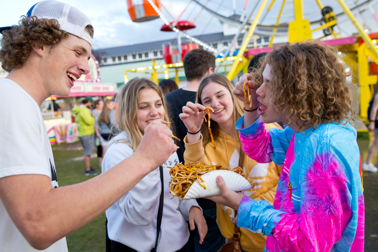 Photo by Bess Bird. Teenagers share in heaping portions of french fries.