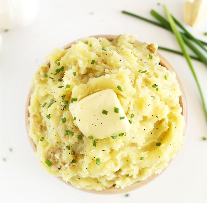 Try this six-ingredient mash. It's creamy, buttery, fluffy and nicely spiced with roasted garlic and chives. Photo credit: Minimalist Baker .