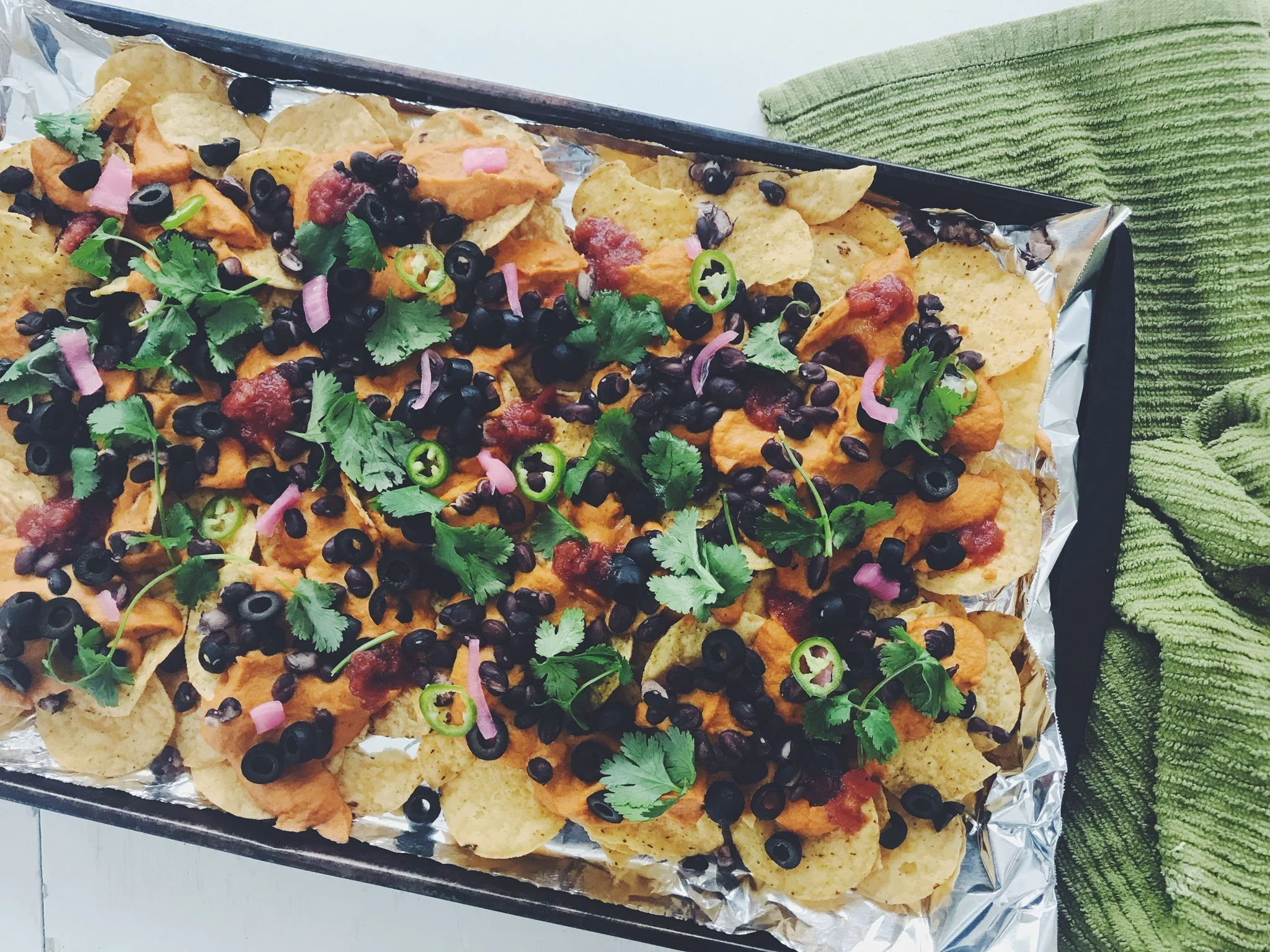 The key to this recipe is the sweet potato vegan cheese, then you just need tortilla chips and can customize the toppings from there. Photo by Addy Cummings.