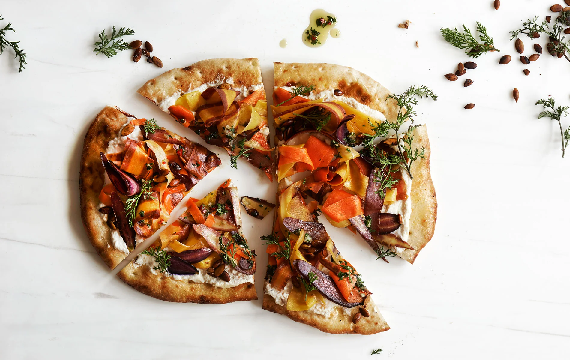 Each individually sized vegan pizza pie is a feast for your eyes. Photo credit: Adrian Mueller, PLANTLAB