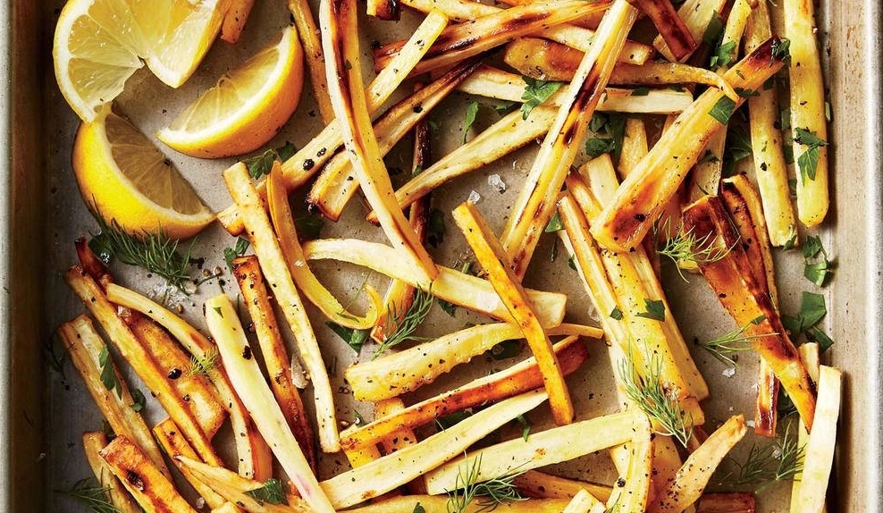 Parsnips are a root vegetable closely related to carrots and parsley. They have a decadently sweet, earthy flavor made richer by winter frosts. Here, the root is paired with tangy lemon juice and some fresh, mild herbs, and roasted to a crisp. Feel free to adjust these additions based on your preferences. You really can't go wrong! Photo by Greg Dupree from Cooking Light